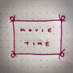A piece of paper with the words "Movie Time" on it